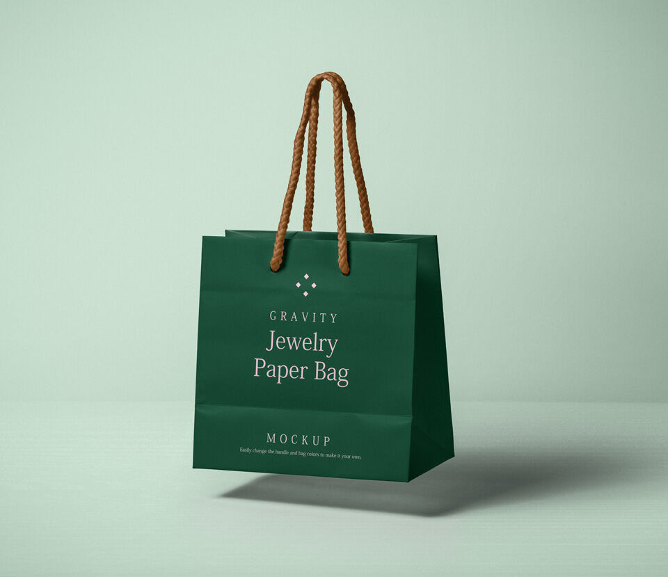 A green paper bag with laces